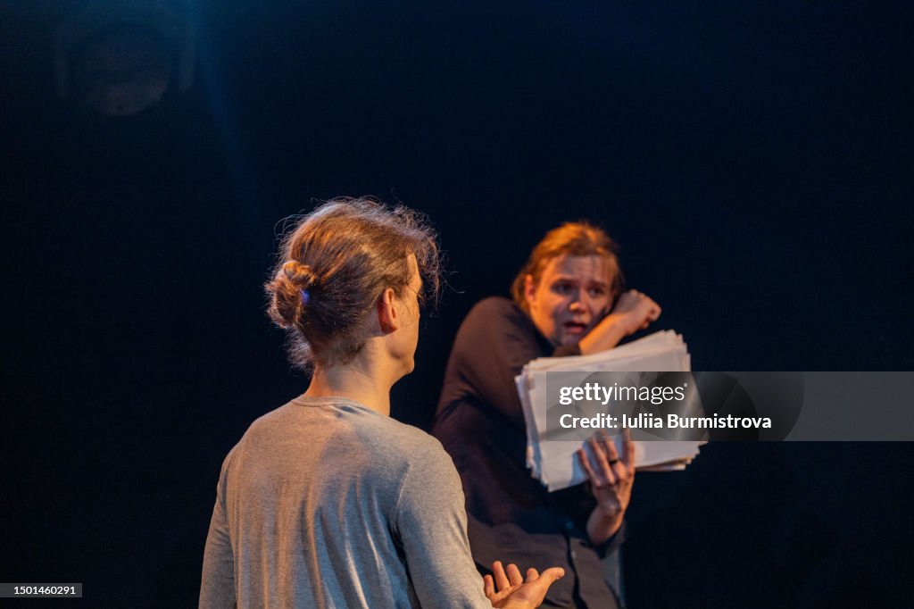 Talented young male participants of amateur theater rehearsing on stage in student theater club