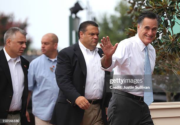 Republican presidential candidate, former Massachusetts Gov. Mitt Romney waves to members of the media as he arrives at the USS Wisconsin August 11,...