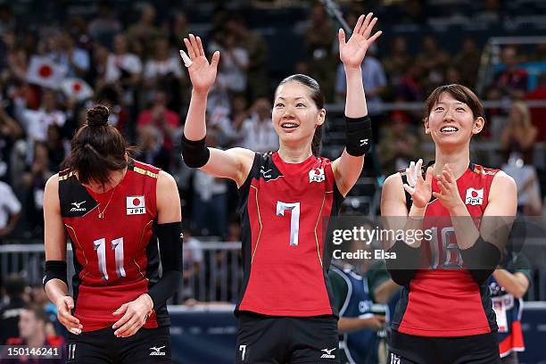 Ai Otomo, Kaori Inoue and Yukiko Ebata of Japan celebrate after defeating Korea to win their Women's Volleyball bronze medal match on Day 15 of the...