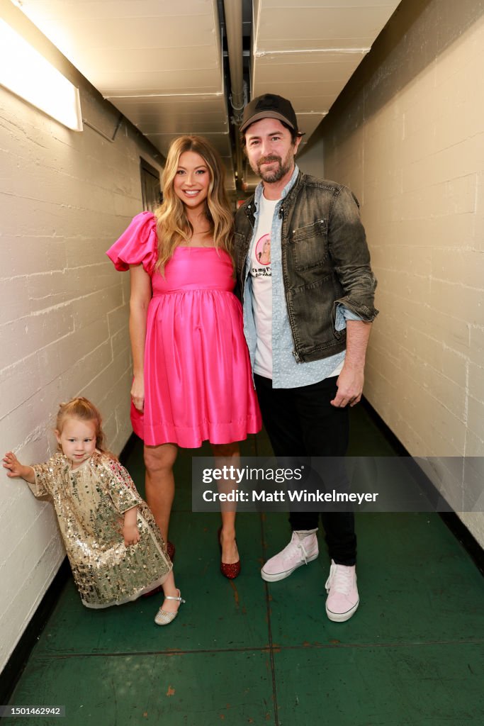 Stassi Clark Hartford Clark, Stassi Schroeder Clark, and Beau Clark pose bakstage ...