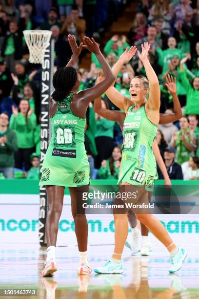 Alice Teague-Neeld of the Fever and Sunday Aryang of the Fever celebrate the win during the Super Netball Semifinal match between Melbourne Vixens...