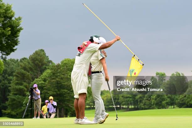 Jiyai Shin of South Korea celebrates with her caddie after winning the tournament on the play off first hole on the 18th green following the final...