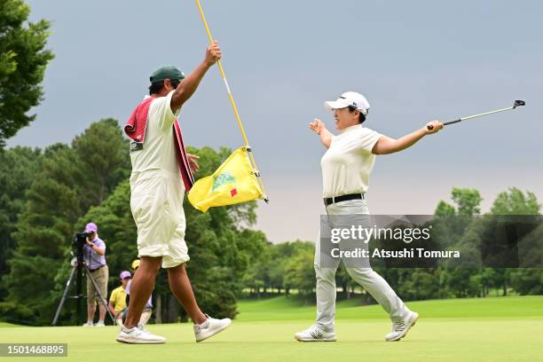 Jiyai Shin of South Korea celebrates with her caddie after winning the tournament on the play off first hole on the 18th green following the final...