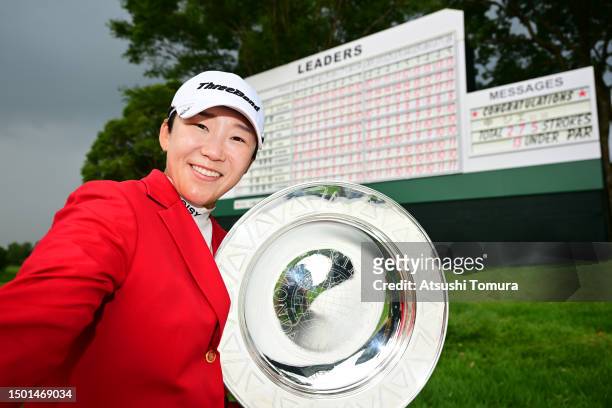 Jiyai Shin of South Korea imitates the selfie after winning the tournament following the final round of Earth Mondahmin Cup at Camellia Hills Country...