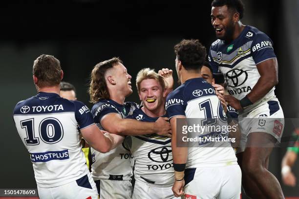 Tom Dearden of the Cowboys celebrates with team mates after scoring a try during the round 17 NRL match between South Sydney Rabbitohs and North...