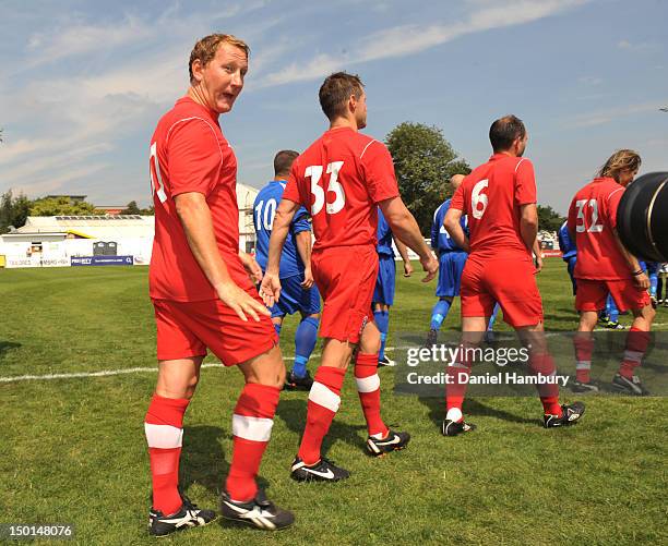 Ray Parlour of Wembley FC takes to the pitch with team mates during a Budweiser FA Cup Extra Preliminary Round at Vale Farm Stadium, on August 11,...