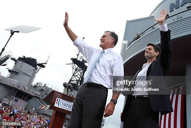 Republican presidential candidate, former Massachusetts Gov. Mitt Romney and U.S. Rep. Paul Ryan wave as Ryan is announced as his running mate in...