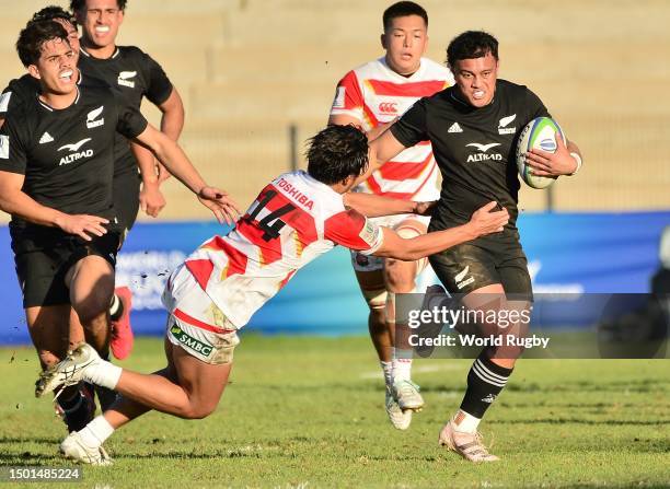 Ajay Faleafaga of New Zealand tackled by Ryohei Imano of Japan during the World Rugby U20 Championship 2023, group A match between New Zealand and...