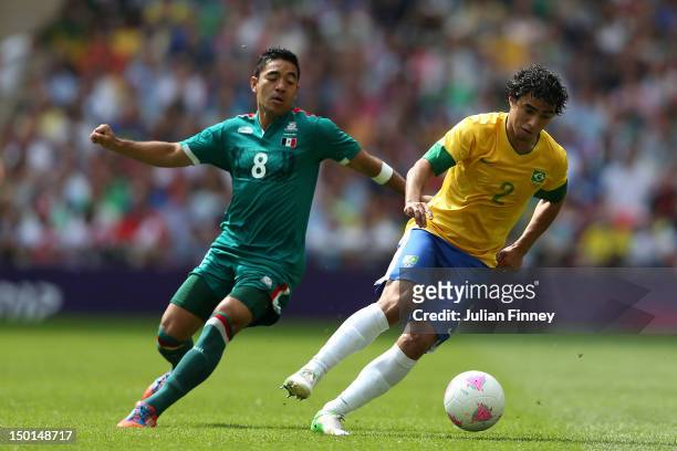 Marco Fabian of Mexico in action against Rafael of Brazil during the Men's Football Final between Brazil and Mexico on Day 15 of the London 2012...