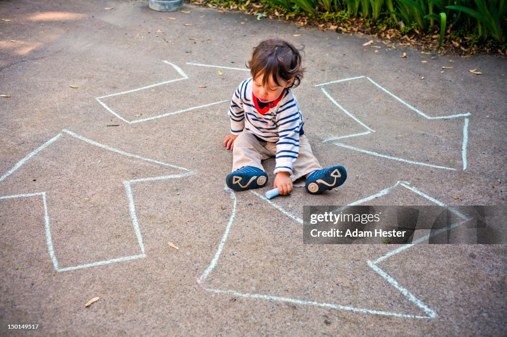 A young boy with a renew and recycle logo.