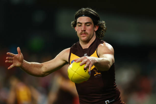 Jai Newcombe of the Hawks kicks during the round 15 AFL match between Gold Coast Suns and Hawthorn Hawks at Heritage Bank Stadium, on June 25 in Gold...