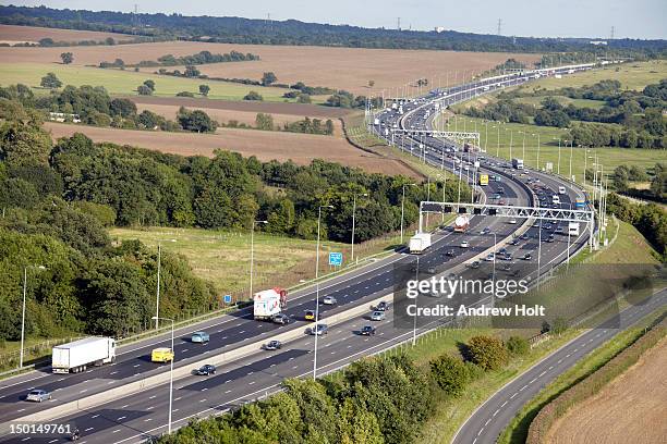 aerial view of traffic on m25 motorway - essex england stock pictures, royalty-free photos & images