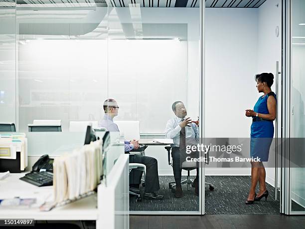 coworkers in discussion in office conference room - seattle open stock pictures, royalty-free photos & images