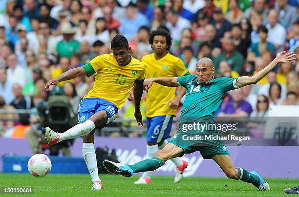 Alex Sandro of Brazil battles for the ball with Jorge Enriquez of Mexico during the Men's Football Final between Brazil and Mexico on Day 15 of the...