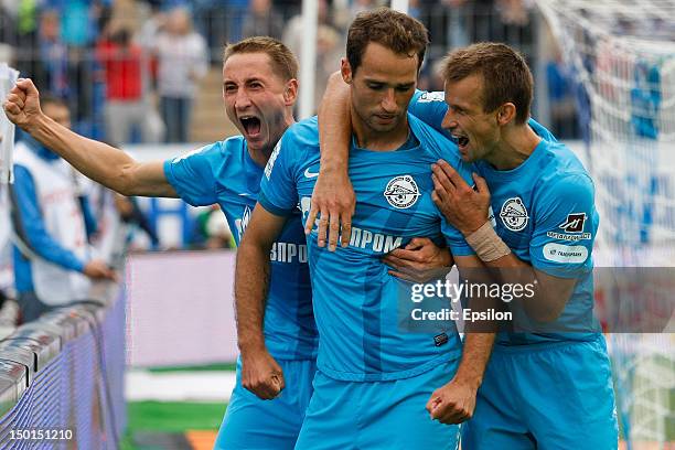 Roman Shirokov of FC Zenit St. Petersburg celebrates his goal with Vladimir Bystrov and Sergei Semak of FC Zenit St. Petersburg, during the Russian...