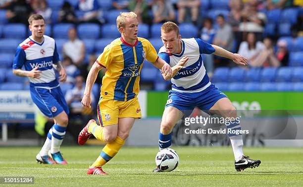 Jonny Williams of Crystal Palace moves away from Alex Pearce during the pre season friendly match between Reading and Crystal Palace at the Madejski...