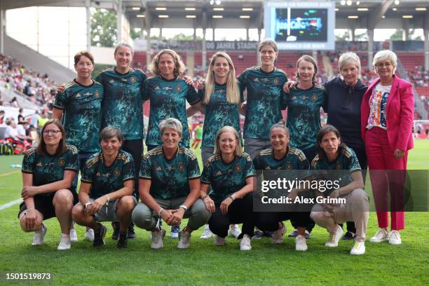 Head coach Silvia Neid and players of the German national team that had won the 2003 World Cup pose prior to the Women's international friendly...