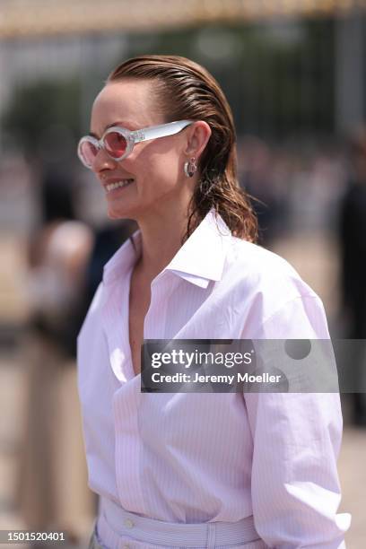 Amber Valletta is seen wearing a round shades and rose flanell shoutside Dior Homme during the Menswear Spring/Summer 2024 as part of Paris Fashion...