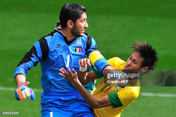 Mexico's goalkeeper Jose Corona clashes with Brazil's forward Neymar in the men's football final match between Brazil and Mexico at Wembley stadium...