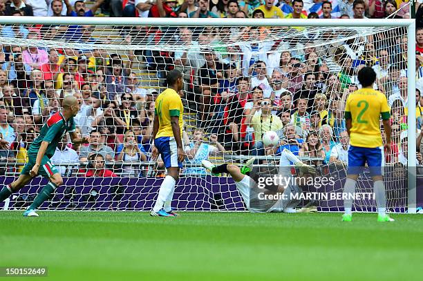 Brazil's goalkeeper Gabriel fails to catch a goal by Mexico's forward Oribe Peralta in the men's football final match between Brazil and Mexico at...
