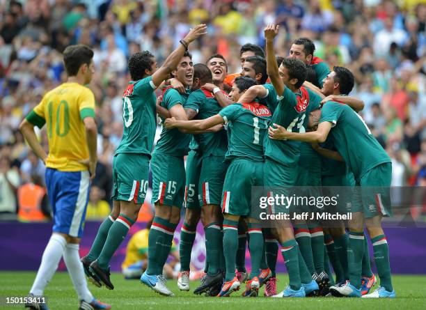 Mexico players celebrate after winning gold in the Men's Football Final between Brazil and Mexico on Day 15 of the London 2012 Olympic Games at...