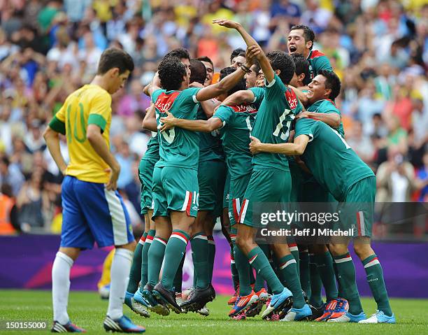 Mexico players celebrate after winning gold in the Men's Football Final between Brazil and Mexico on Day 15 of the London 2012 Olympic Games at...