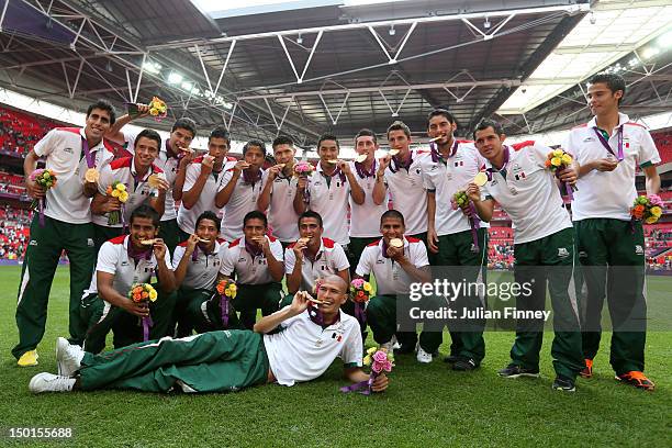 Gold medal winners Mexico pose with their medals after the medal ceremony for the Men's Football Final between Brazil and Mexico on Day 15 of the...