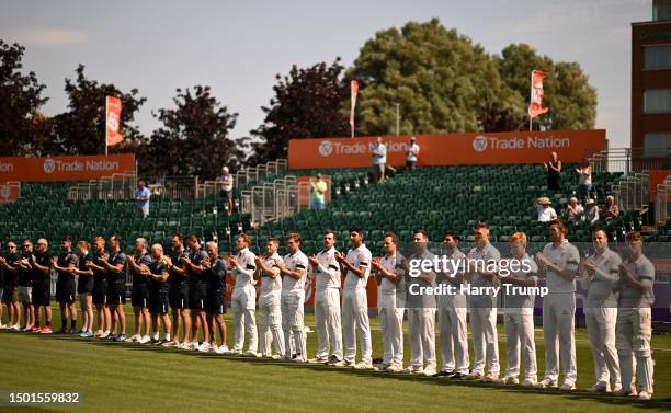 Players of Somerset, Nottinghamshire and family members of Barnaby Webber line up for a minutes applause in memory of those who lost their lives in...