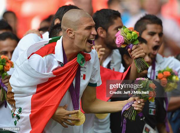 Jorge Enriquez of Mexico celebrates winning the gold medal after the Men's Football Final between Brazil and Mexico on Day 15 of the London 2012...