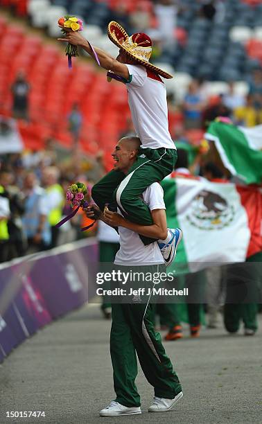 Jorge Enriquez of Mexico celebrates with his team mates after winning the gold medal following the Men's Football Final between Brazil and Mexico on...