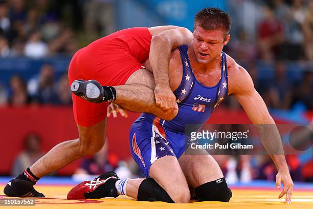 Ibrahim Bolukbasi of Turkey and Jake Herbert of the United States compete in the Men's Freestyle 84 kg Wrestling on Day 15 of the London 2012 Olympic...