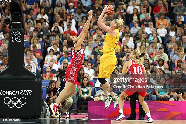 Lauren Jackson of Australia attempts a shot in the second half against Anna Petrakova and Ilona Korstin of Russia during the Women's Basketball...
