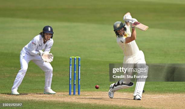 Australia batter Ellyse Perry drives watched by Amy Jones during day four of the LV= Insurance Women's Ashes Test match between England and Australia...