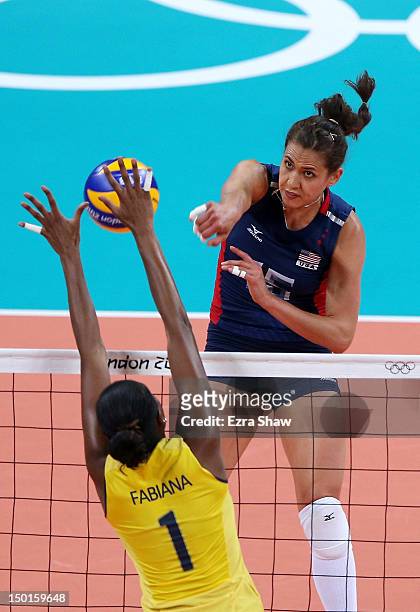 Logan Tom of United States spikes the ball against Fabiana Claudino of Brazil during the Women's Volleyball gold medal match on Day 15 of the London...