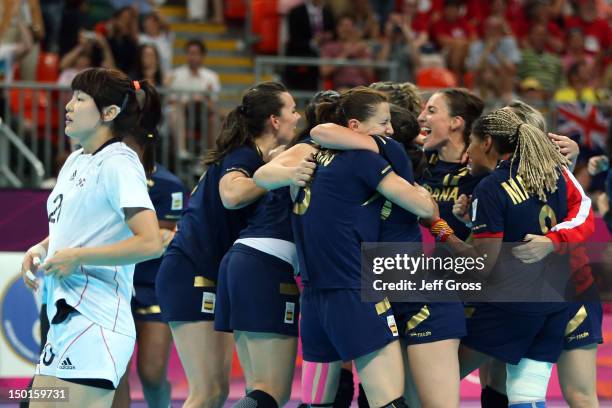 Spain celebrates after defeating South Korea in the Women's Handball Bronze Medal Match on Day 15 of the London 2012 Olympics Games at Basketball...