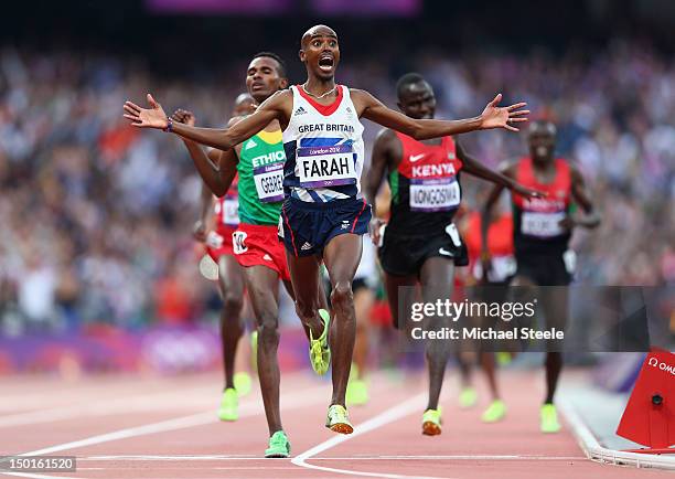 Mohamed Farah of Great Britain crosses the finish line to win gold ahead of Dejen Gebremeskel of Ethiopia and Thomas Pkemei Longosiwa of Kenya in the...