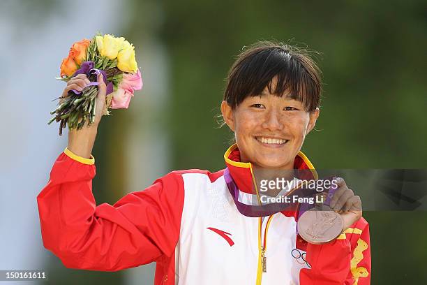 Bronze medalist Shenjie Qieyang of China attends the medal ceremony of the Women's 20km Walk on Day 15 of the London 2012 Olympic Games on the...
