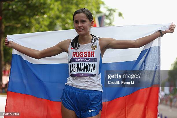 Elena Lashmanova of Russia celebrates after winning the Women's 20km Walk on Day 15 of the London 2012 Olympic Games on the streets of London on...