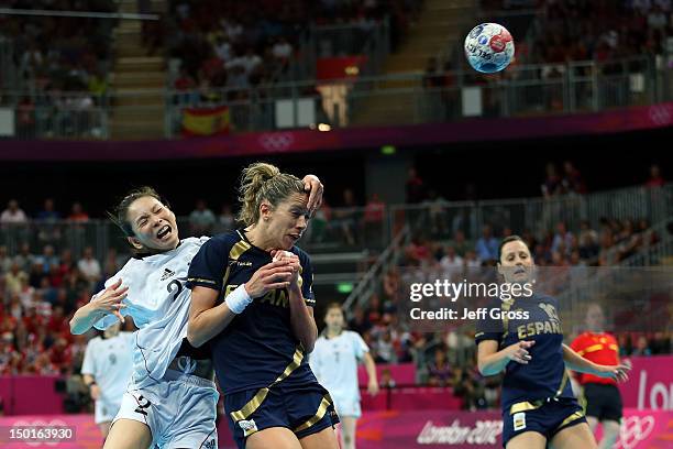 On A Kim of South KoKorea throws the ball against Begona Fernandez Molinos of Spain during the Women's Handball Bronze Medal Match on Day 15 of the...