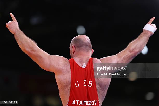 Artur Taymazov of Uzbekistan celebrates a gold medal in the Men's Freestyle 120 kg Wrestling on Day 15 of the London 2012 Olympic Games at ExCeL on...