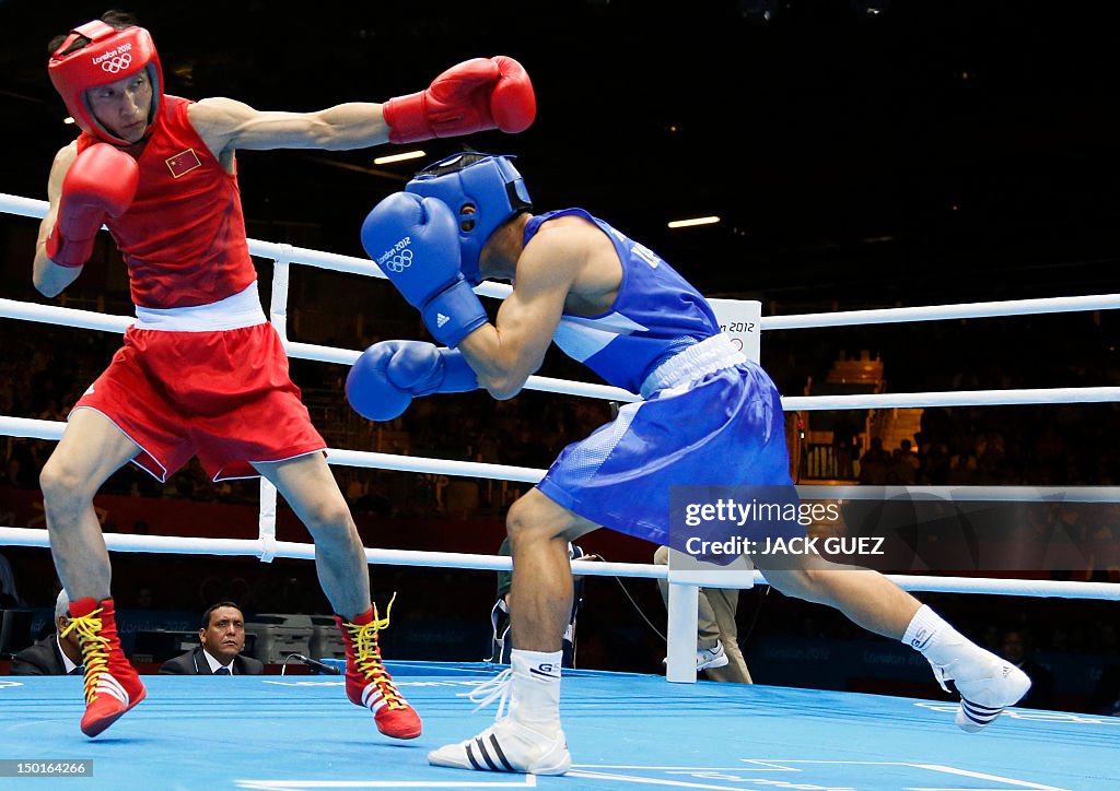 Zeming Gou Shiming Zou of China defends against Kaeo Pongprayoon of Thailand ...