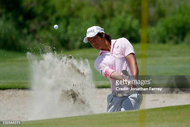 Ryo Ishikawa of Japan hits out of the sand on the fourth hole during Round Three of the 94th PGA Championship at the Ocean Course on August 11, 2012...