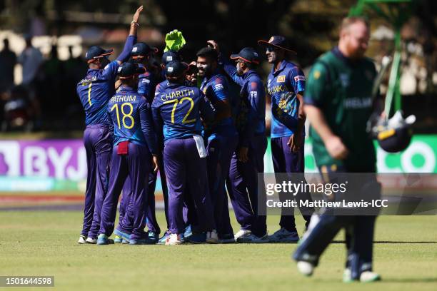 Lahiru Kumara of Sri Lanka celebrates with teammates after dismissing Paul Stirling of Ireland during the ICC Men's Cricket World Cup Qualifier...