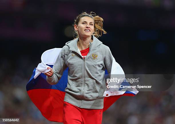 Anna Chicherova of Russia celebrates winning gold in the Women's High Jump Final on Day 15 of the London 2012 Olympic Games at Olympic Stadium on...