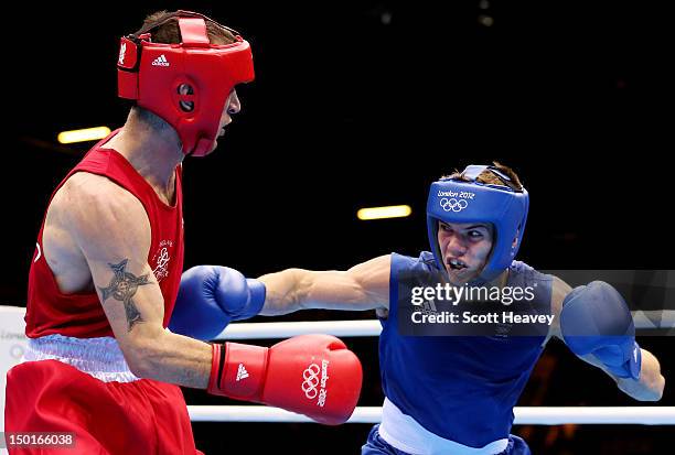 Luke Campbell of Great Britain throws a punch against John Joe Nevin of Ireland during the Men's Bantam Boxing final bout on Day 15 of the London...