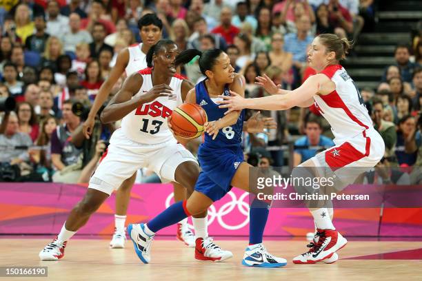 Edwige Lawson-Wade of France is double-teammed by Sylvia Fowles and Lindsay Whalen of United States in the second quarter during the Women's...