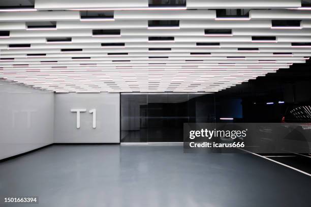 entrance to underground parking lot of office building - office building entrance night stock pictures, royalty-free photos & images