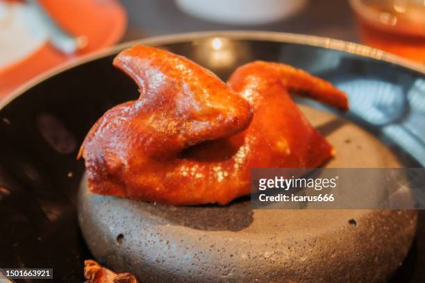 crispy pigeon - burnt chicken stock pictures, royalty-free photos & images