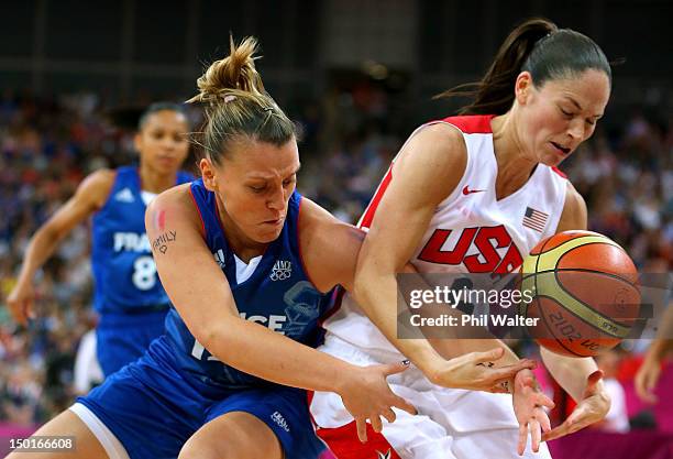 Sue Bird of United States and Marion Laborde of France battle for the ball in the second quarter during the Women's Basketball Gold Medal game on Day...