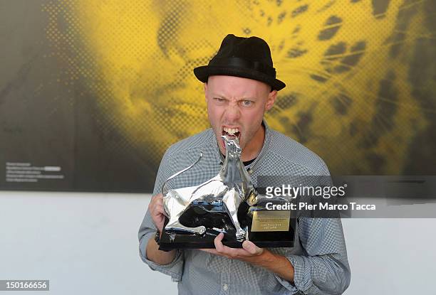 DirectorJoel Potrykus poses with the Best Emerging Director award during the 65th Locarno Film Festival on August 11, 2012 in Locarno, Switzerland.